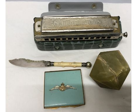 Miscellany including onyx paperweight, butter knife, Super Chromonica Harmonica and an RAF powder compact. 