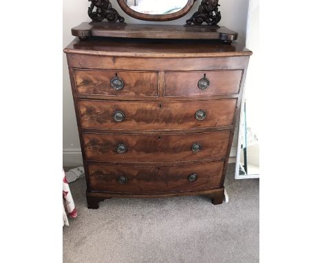 A 19th century mahogany bow fronted chest of drawers. 2 short over 3 long drawers on bracket feet. 91cms w x 48cms d x 104cms