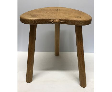 Robert Thompson Mouseman, Oak tripod stool. 45cms h, 37cms w x 29cms d.