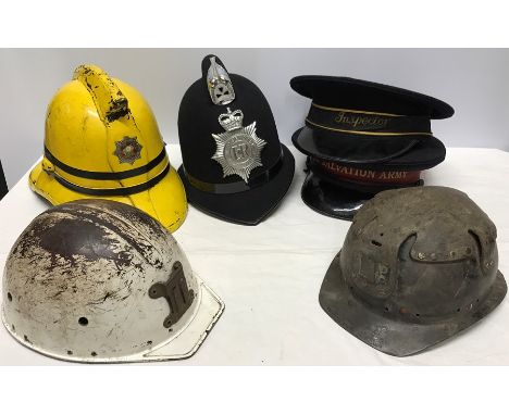 Hat collection inc BR Inspector cap, Merseyside Police, South Yorkshire Fireman, Salvation Army and 2 miners pit helmets. 