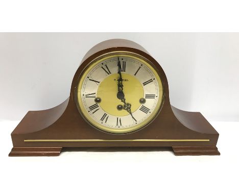 A Westminster chiming mantle clock. 