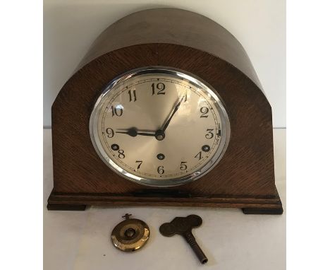 Oak cased mantle clock with Westminster chime Garrard movement. 22cms 