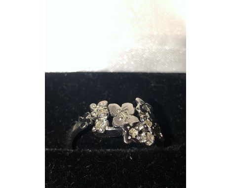 White metal and diamond flower ring marked .750 size K/L