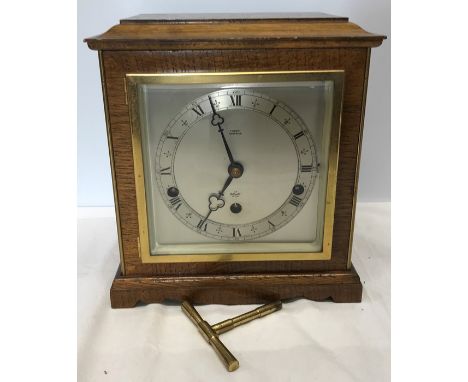 Oak cased Elliot mantle clock, Westminster chimes, retailer F Benoy Nantwich. 