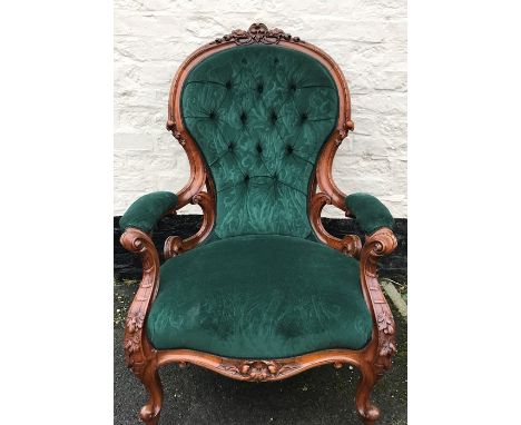A good quality 19thC carved walnut armchair button back with upholstered armrests.