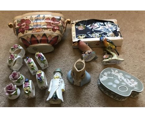 A mixed lot of ceramics to include Royal Worcester candle snuff 'Budge' and a Bullfinch. Royal Albert Peter Rabbit, 2 napkin 