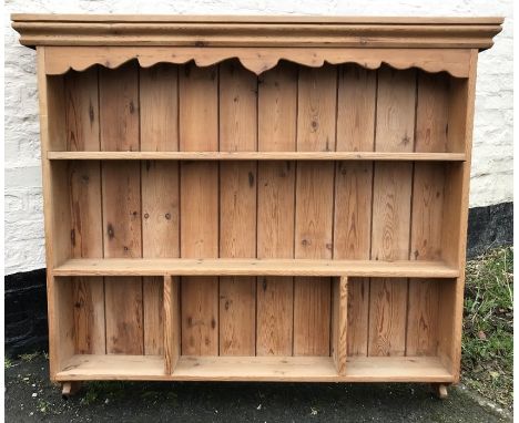 A pine wall mounted 3 height shelf unit, 110cms h x 125cms w. 