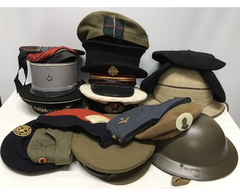 Collection of 19 military hats inc British 2nd WW, French and Russian military, Berets, pith helmet, Army and Navy hats. 