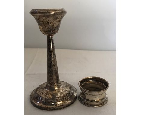 Hallmarked small silver candlestick, 13cms with a silver napkin ring. 