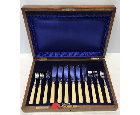 Oak cased hallmarked silver ivory handled knife and fork set, Garrard and Co London. 1917. 