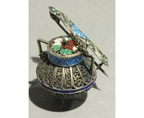 A Continental enamel decorated silver filigree brooch formed as a cooking pot and ladle 