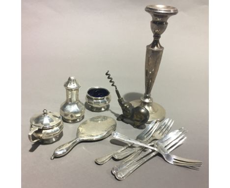 A small quantity of silver items, including a candlestick, a cruet set and a brass corkscrew