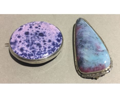 Two Ruskin Arts &amp; Crafts white metal mounted high fired ceramic brooches, both with typical glaze and impressed Ruskin, o