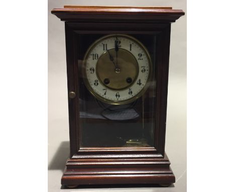 A Victorian walnut cased mantle clock