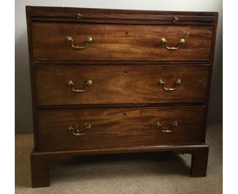 A George III mahogany caddy top chest of drawers, with a brushing slide, the rectangular top above the brushing slide with br
