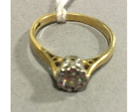 An 18 ct gold diamond set ring (2 grammes total weight)