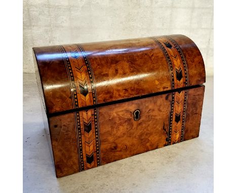 A Victorian walnut Tunbridge Ware parquetry inlaid tea caddy, the hinged domed top opening to reveal a twin division interior