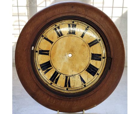 An early 20th century folkart wooden clock dial with surround. 33cm diameter. 