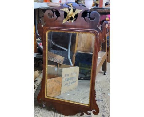 A George III mahogany and parcel gilt Vauxhall looking glass, shaped cresting pierced and carved with Ho-Ho bird, rounded rec