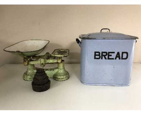 A enamelled bread bin and a set of vintage kitchen scales with weights 