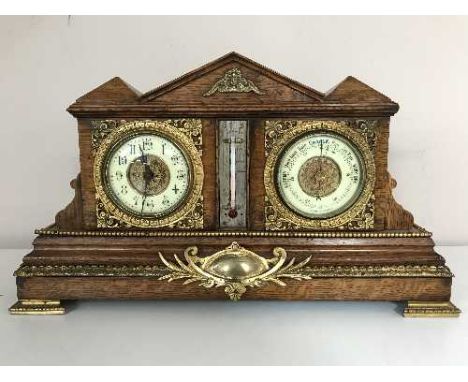 An antique oak bracket clock with gilt and enamelled dial, fitted with a barometer, with ormolu mounts 