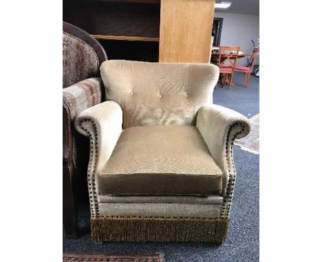 A mid 20th century armchair in gold button dralon 