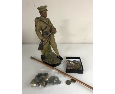 A good collection of militaria - buttons, badges, shell casing caps, swagger stick, five certification cards and a chalk figu