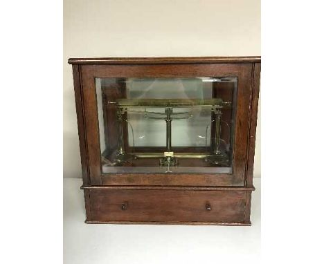 A mahogany cased set of scales stamped Knowles Patent Yarn Balance, Goodbrand & Co. Sole Makers, 19 Victoria Street Mancheste
