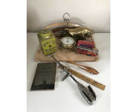 A tray of brass ship's style clock, small tape measure, toffee hammer, vintage coat hangers, rule, Ringtons tin etc 