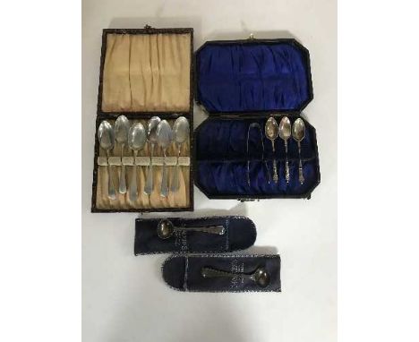 A pair of silver caddy spoons, a boxed set of plated teaspoons and a part set of plated spoons with tongs