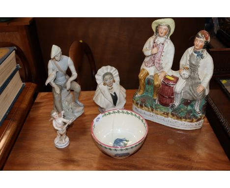 A Lladro type figure; a continental porcelain figure of a cherub; a pottery bowl decorated with elephants and a Staffordshire