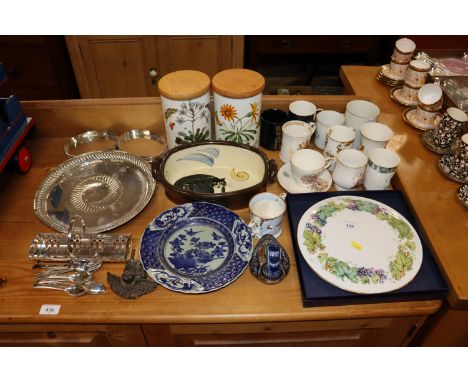 A quantity of silver plated ware; Portmeirion storage jars; Royal Worcester cake plate and various commemorative mugs  