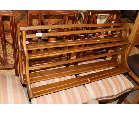 A pair of Ercol plate racks 