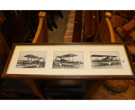 A framed and glazed print of three bi-planes 
