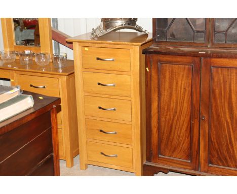 A light oak chest fitted five long drawers 