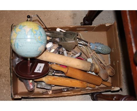 A box containing various vintage kitchenalia and a tin desk globe