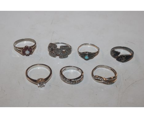 Seven Sterling silver rings to include diamond, ruby and opal