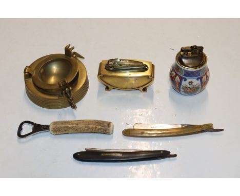 A tray containing a Ronson table lighter; an Imari style table lighter; a brass ash tray, bottle opener and two cut throat ra