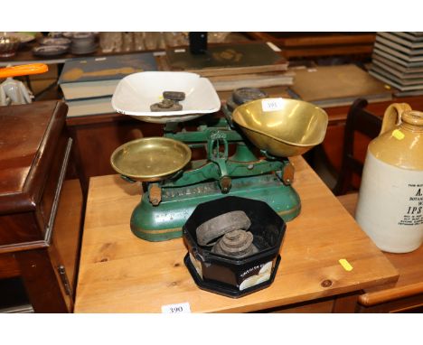 A set of cast iron and brass kitchen scales by J&J Siddons; and another set with enamel pan to include some weights 