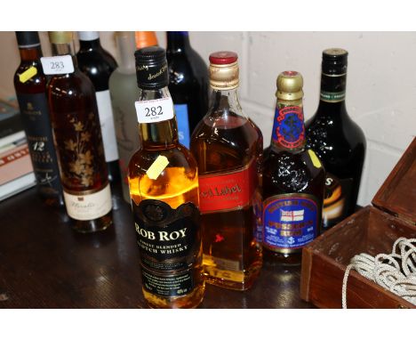A 70cl bottle of Pusser's rum; a 70cl bottle of Johnny Walker Red Label; a bottle of Roy Finest blended Scotch whisky and a b