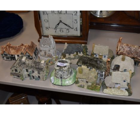 A collection of Lilliput lane style cottages and similar ceramic ones.