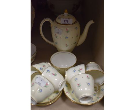 A collection of wedgwood s123 coffee cups and saucers and coffee pot, having cream ground with hand painted floral hair bell 