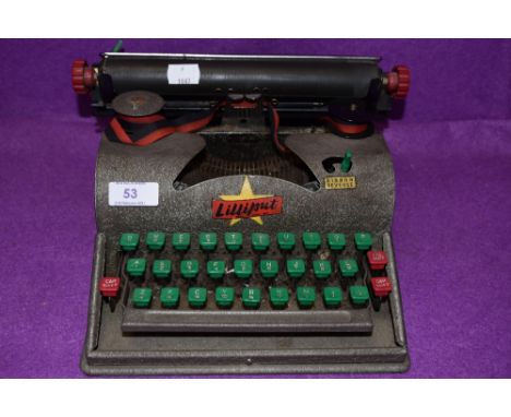 A vintage Lilliput Typewriter.