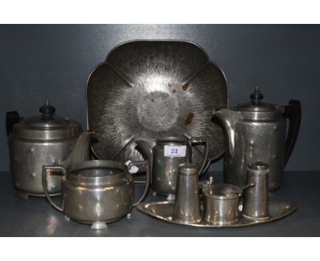 An interesting collection of vintage pewter ware including Tudor rose shaped dish,cruet set, tea/coffee pots, jug and sugan b