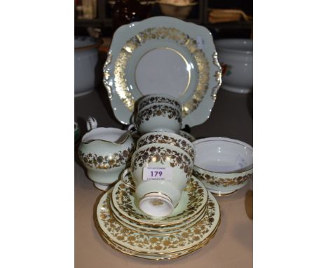 A collection of Paragon china having mint green ground with gilt floral pattern included are cups and saucers, jug and sandwi
