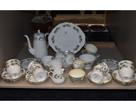 A collection of Crown Staffordshire table ware having dog rose pattern with green, yellow and pink accents on white ground,cu