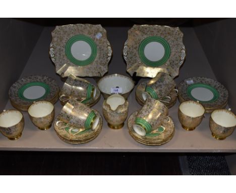 Around forty items of Plant Tuscan china having intricate gilt pattern throughout with green floral accents.
Slight wear to s