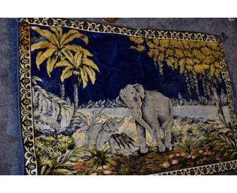A large wool or wool blend rug or tapestry depicting scene of elephants and landscape.