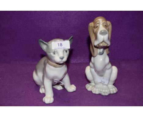 A pair of Lladro Nao figurines, Seated Dog and Cat