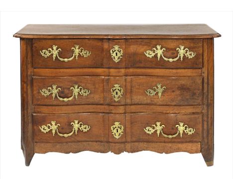 A Régence walnut commode, early 18th century, of serpentine outline with cast gilt mounts, to a shaped apron and feet, 127cm 